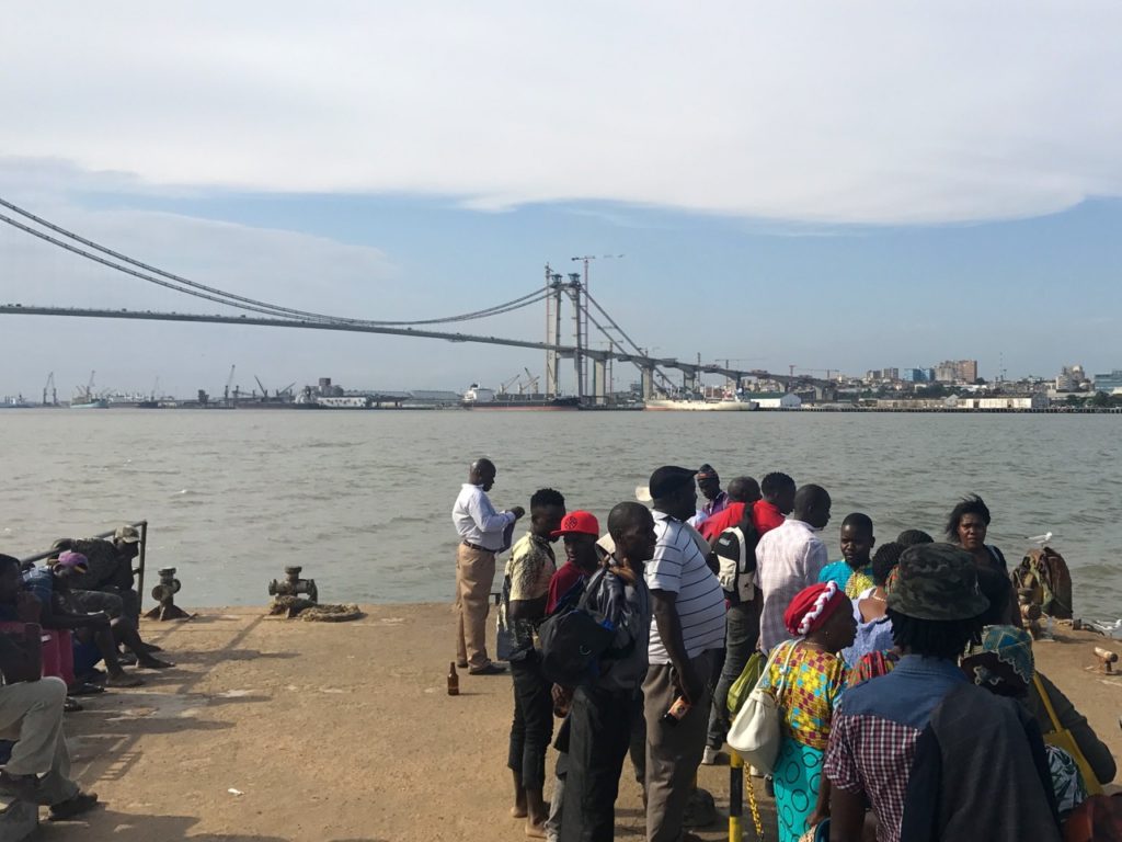passengers waiting for a ferry and bridge under construction, Maputo, Mozambique