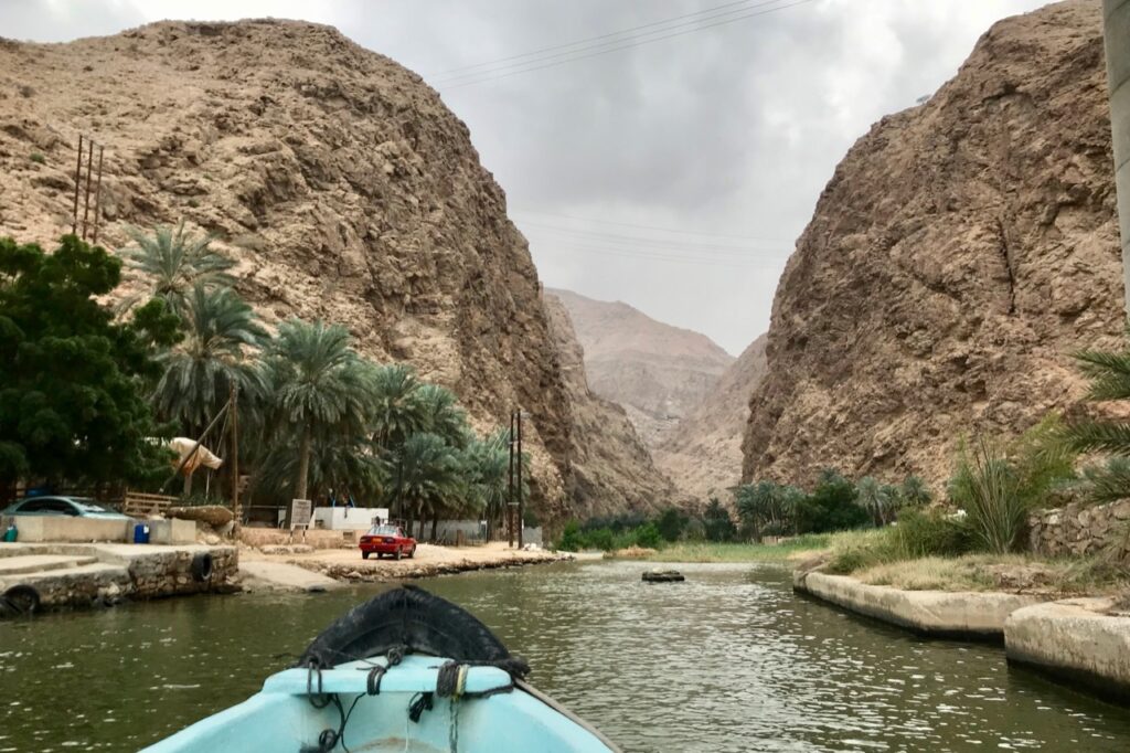 Crossing the river at Wadi Shab, Oman