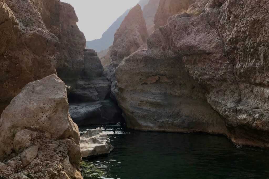 The last pool with the entrance to the cave in Wadi Shab, Oman