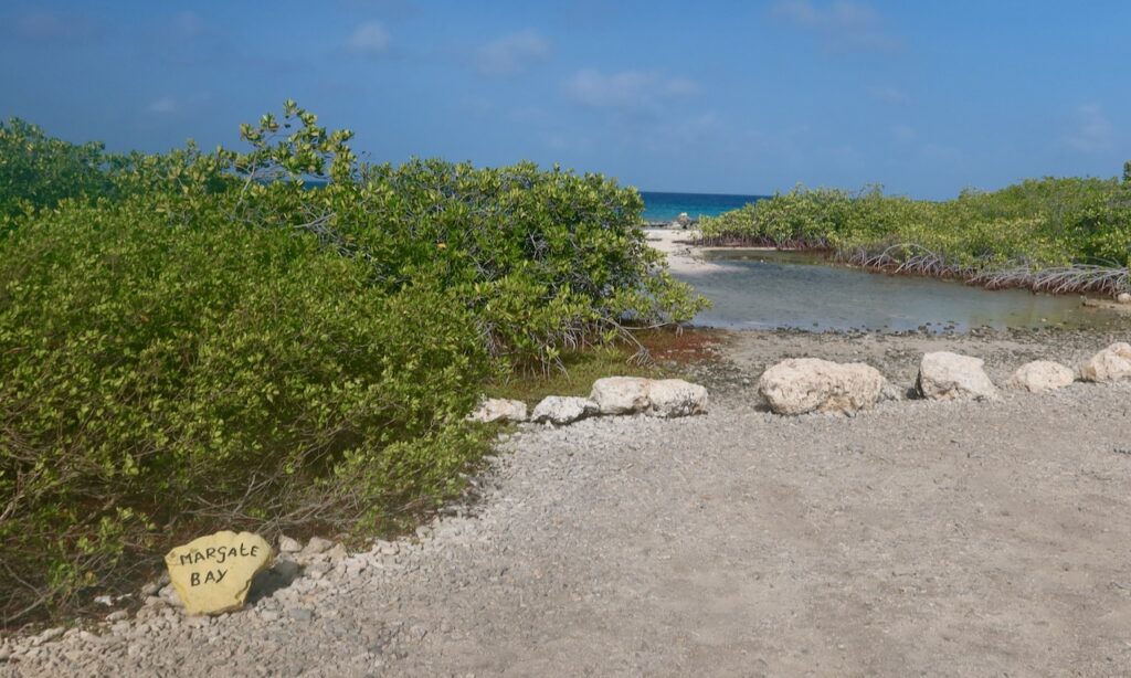 Yellow rock marking Margate dive site on Bonaire