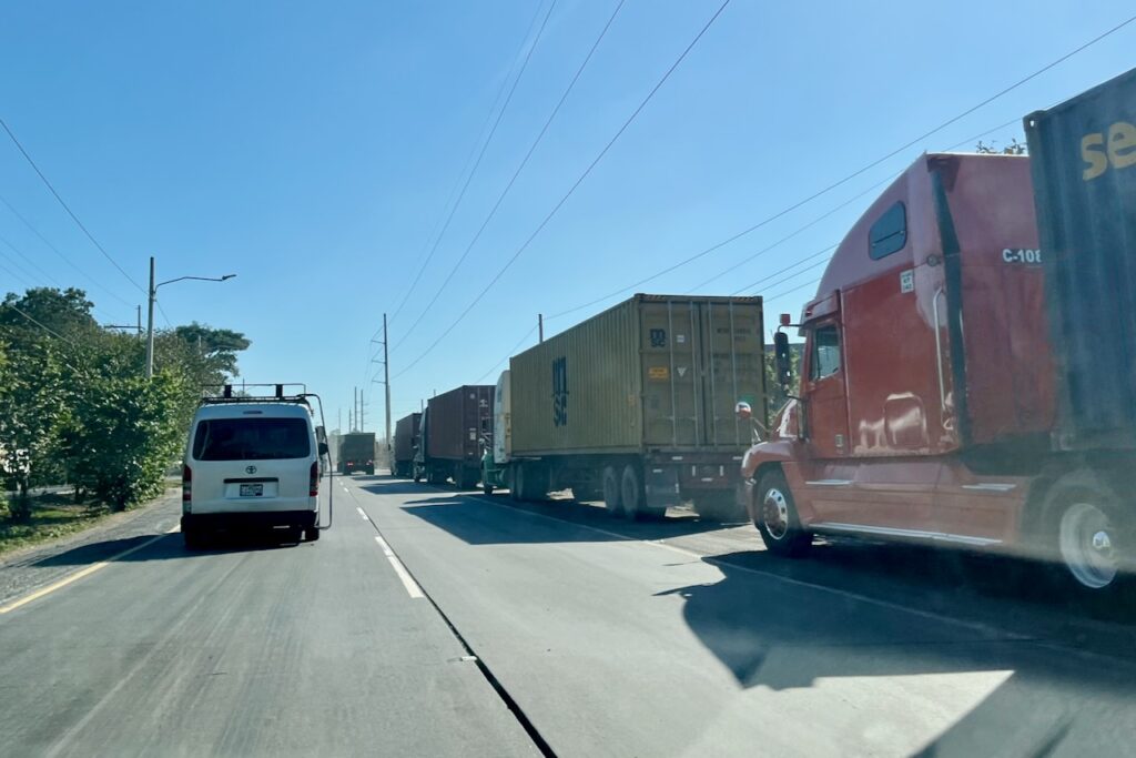 Trucks traffic on the road from Guatemala City to Port San Jose on Pacific coast, Guatemala