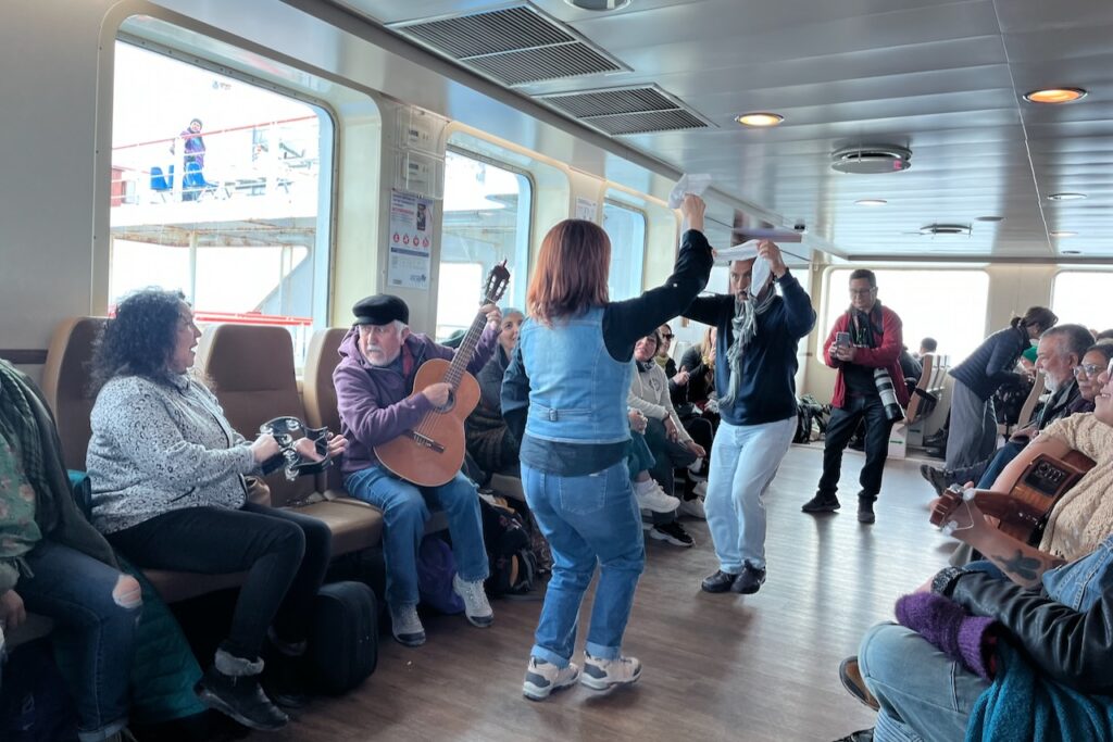 People dancing on a ferry crossing from Punta Arenas to Porvenir, Chile