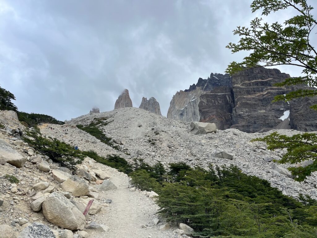Torres peaking through the clouds, Torres lookout hike, Torres del Paine, Chile