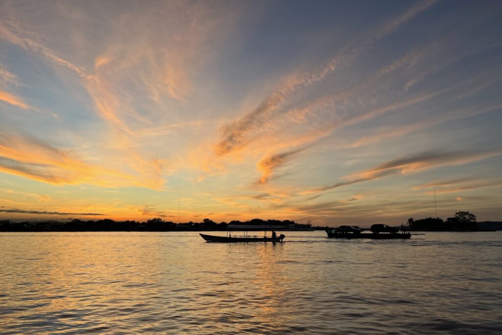 Sunset and a ferry over Peten Itza, view from Flores Island, Guatemala