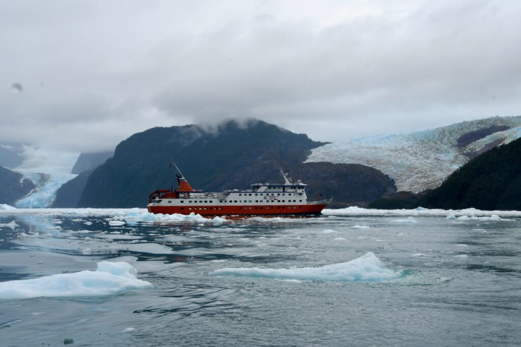 Skorpios III in Calvo Fjord as we go out on small boats into ice, Chile