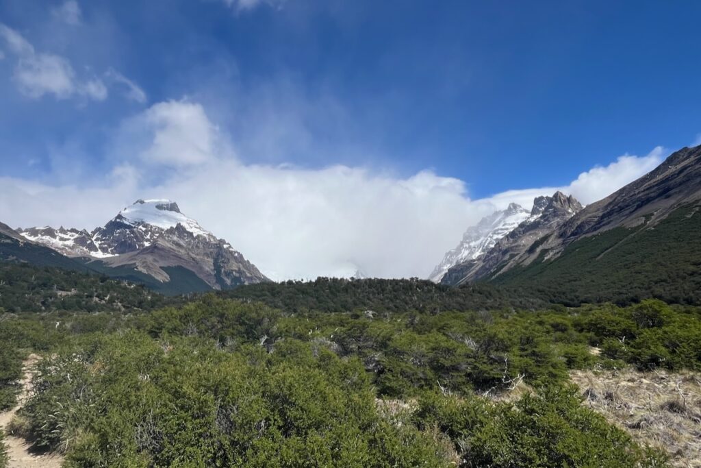 View of Cerro Solo and obstructed by clouds Cerro Torre over Fitz Roy river valley, Argentina