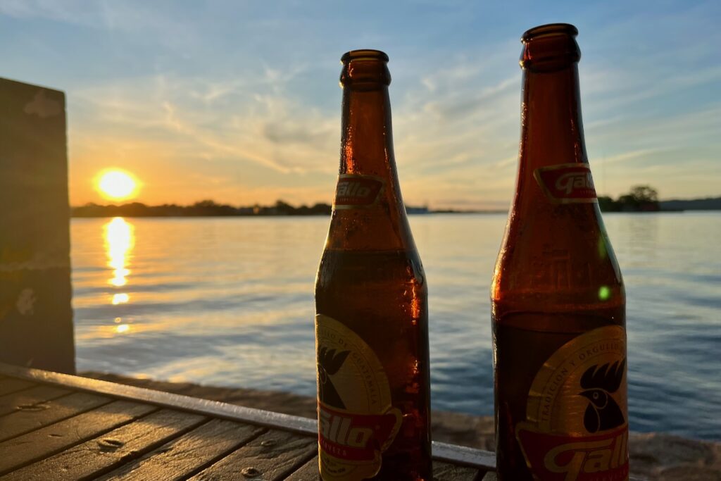 Sunset and Gallo beer, Flores, Guatemala