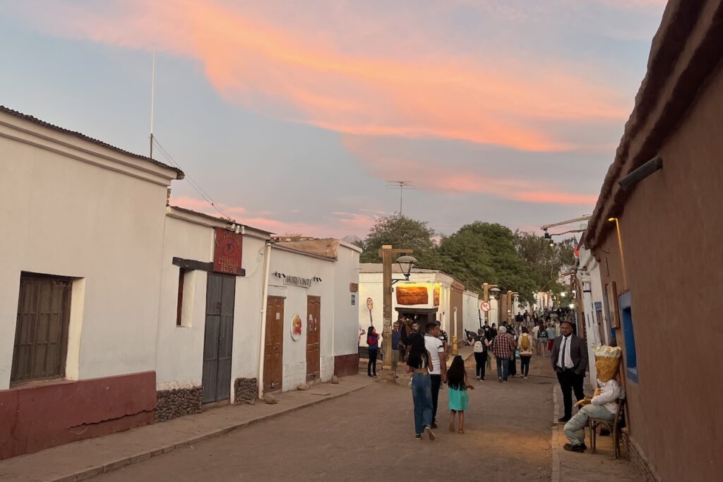 San Pedro de Atacama at sunset on New Year's eve with an Ano Viejo in a chair waiting to be burned, Chile