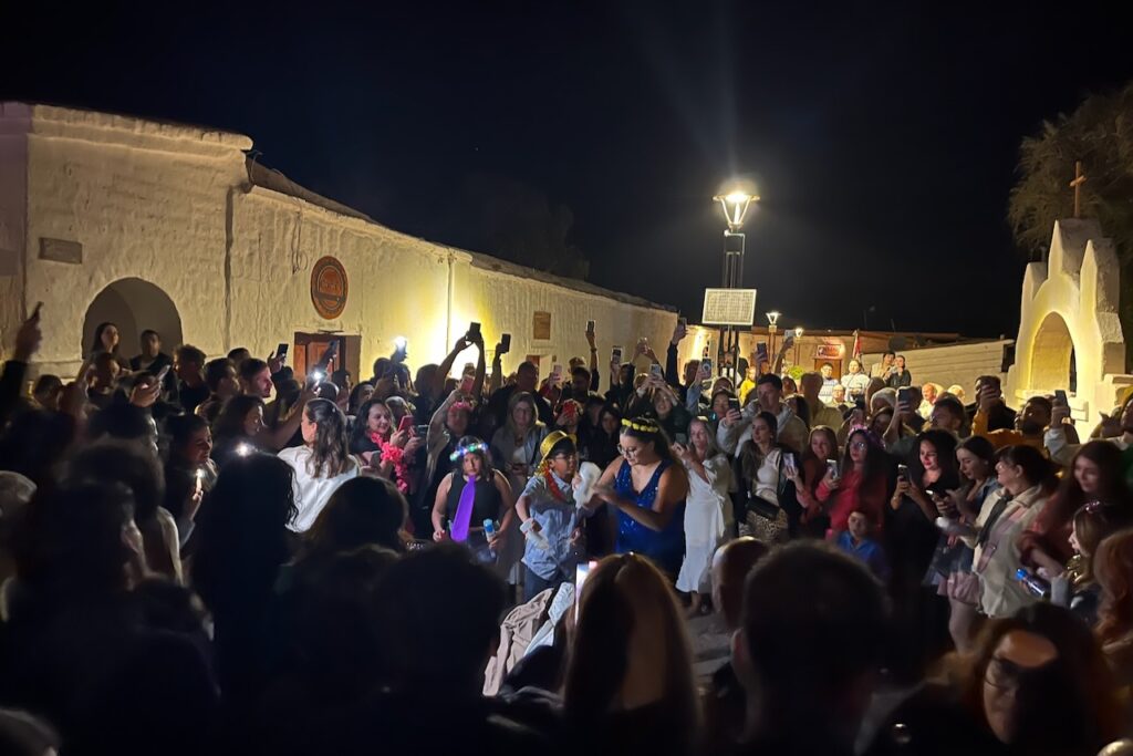 Firing up Ano Viejo at San Pedro de Atacama main square to celebrate New Year, Chile